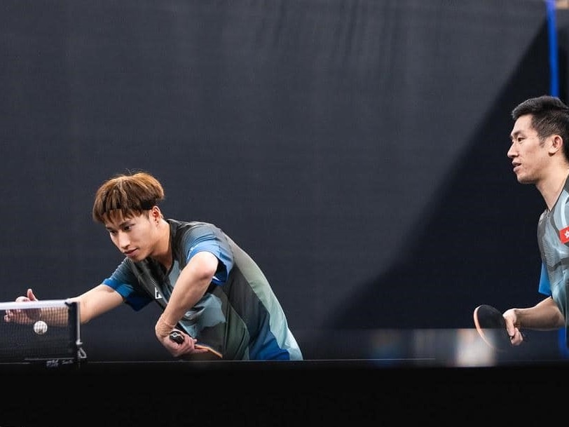 Kwan Man Ho (Left)